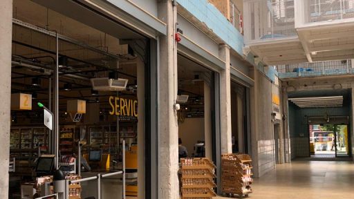 Compact roller door as a partition wall for a shop at Melkhal Enschede