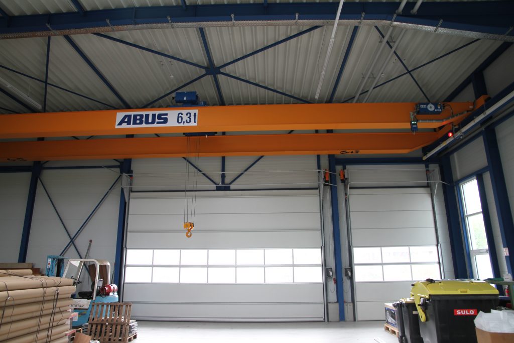 Overhead cranes with a Compact folding door by Rolflex