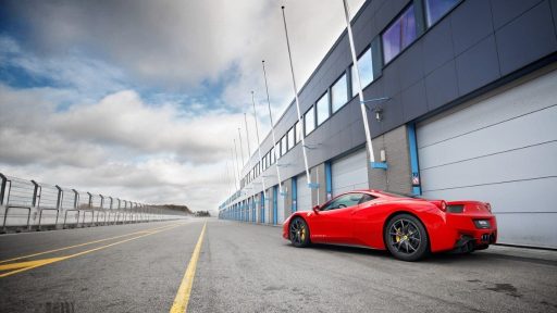 Compact industrial garage doors in the pitlane of TT racetrack
