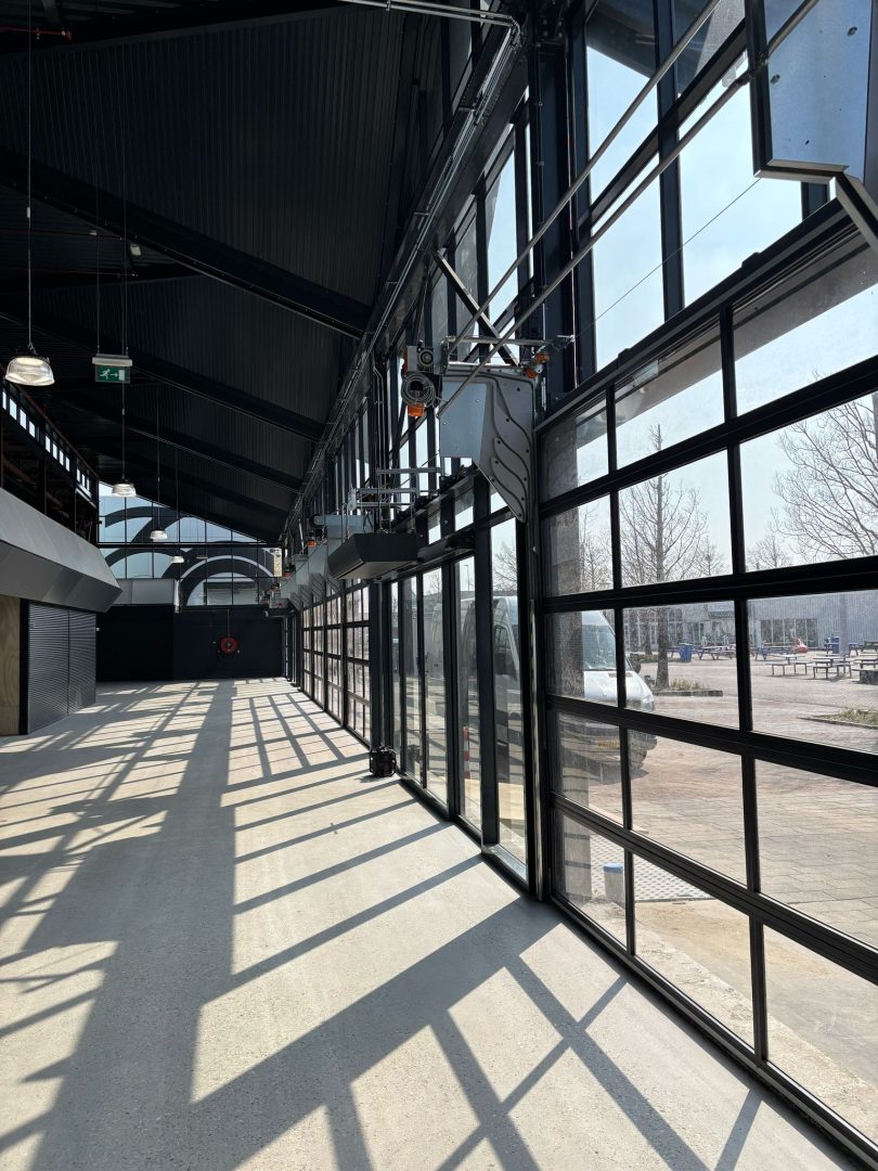 Interior view of a Compact door with daylight streaming into the market hall at Bazaar Beverwijk.